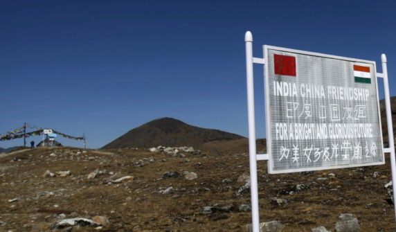 A Signboard Is Seen From The Indian Side Of The Indo China Border At Bumla